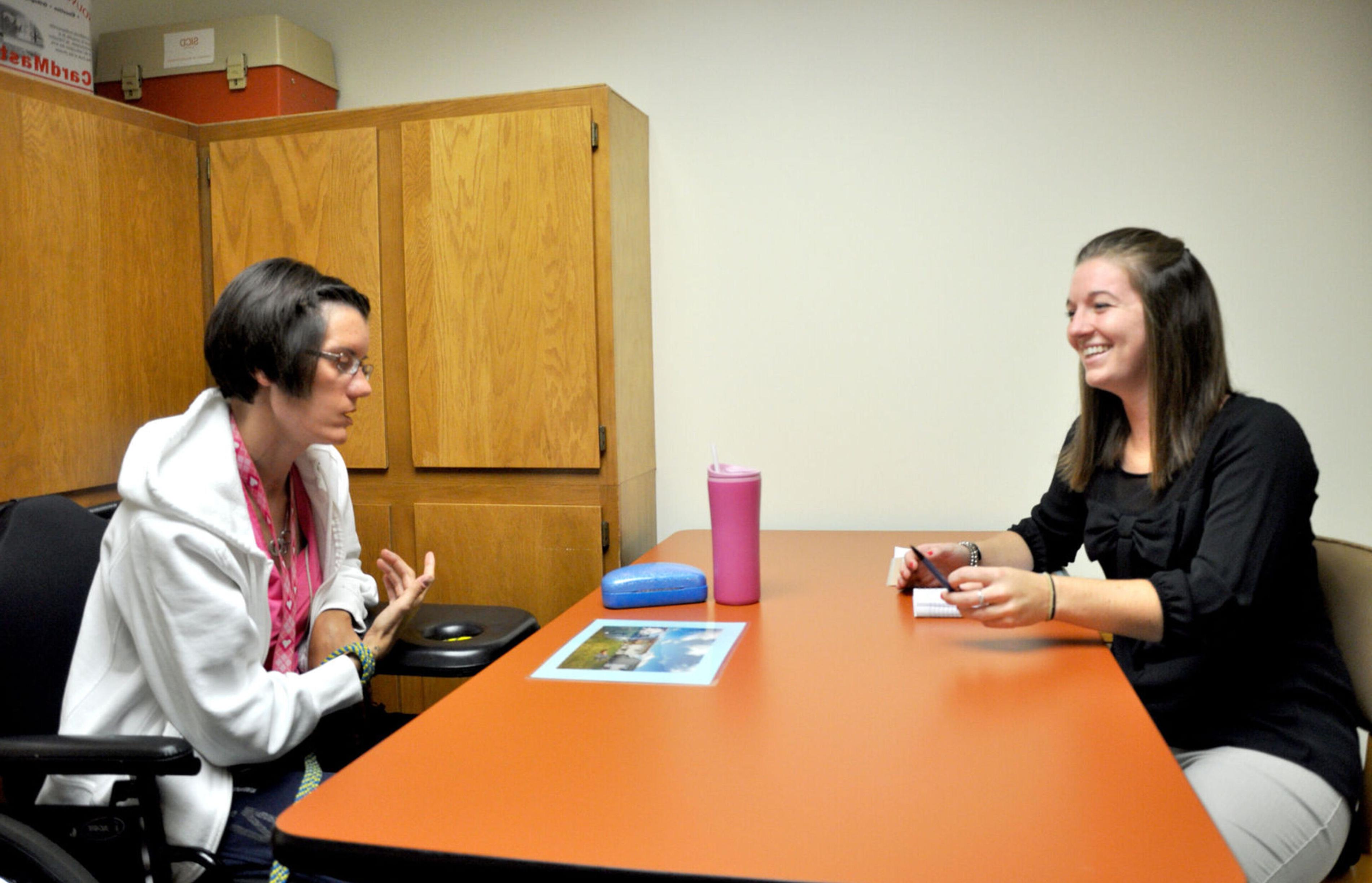 A student works with a client in the Elmira College Speech and Hearing Clinic